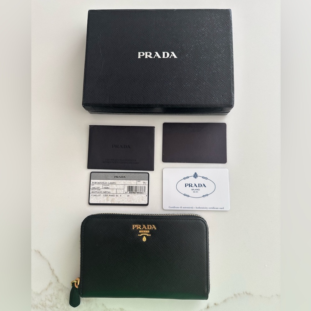 Black PRADA Saffiano zip around wallet with gold hardware.EXCELLENT CONDITION.